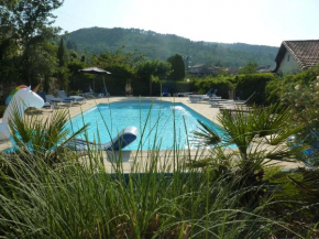 3 cottages around a swimming pool in a small village